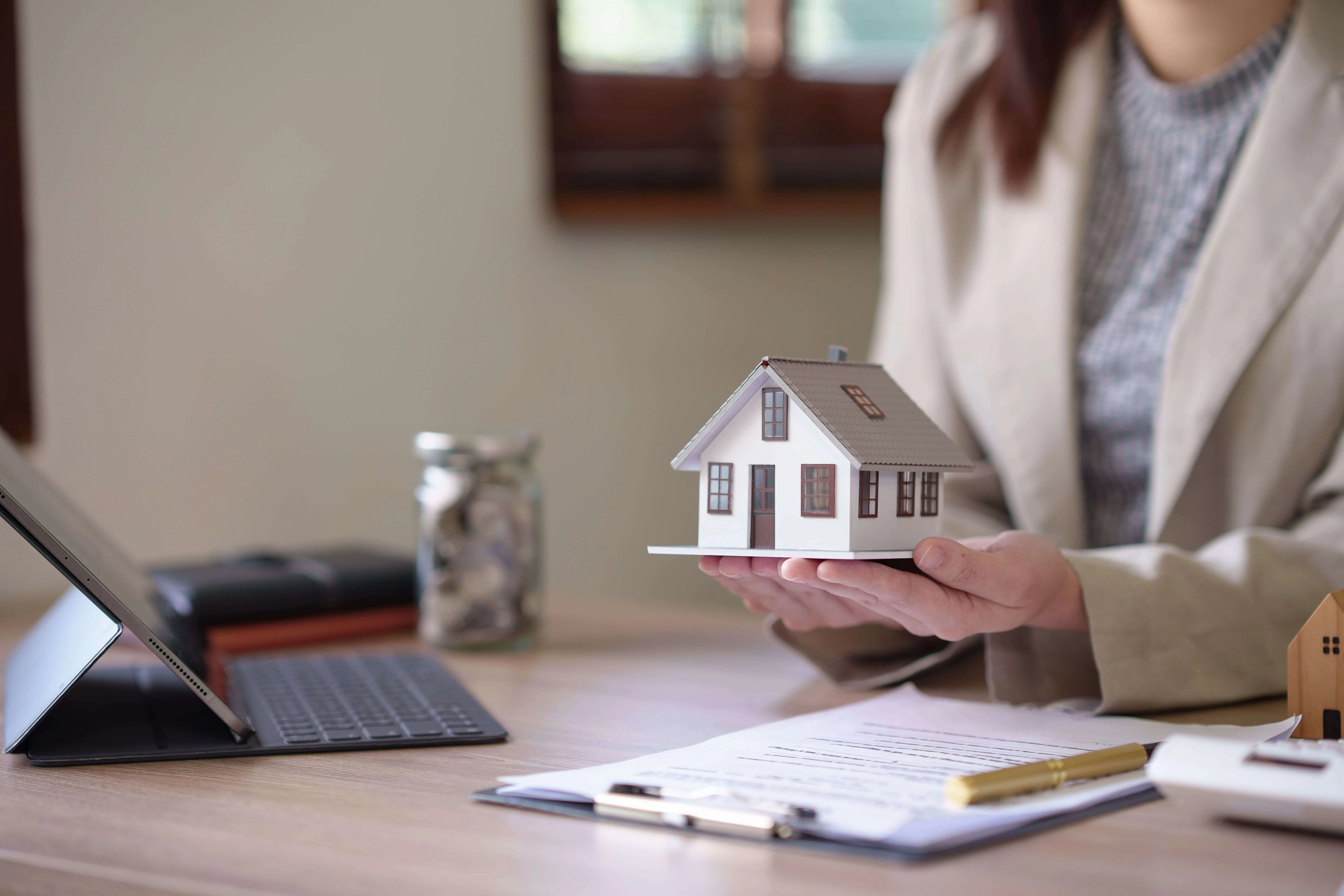 An illustrative depiction of a legal document and pen, symbolizing loan document preparation. This complements Via Novo Law's description as a specialized firm in Real Estate Transaction Law, emphasizing their services in preparing, reviewing, and advising on loan documents. It represents their meticulous attention to detail, compliance with real estate and lending laws, and commitment to safeguarding clients' interests in real estate transactions involving loans.